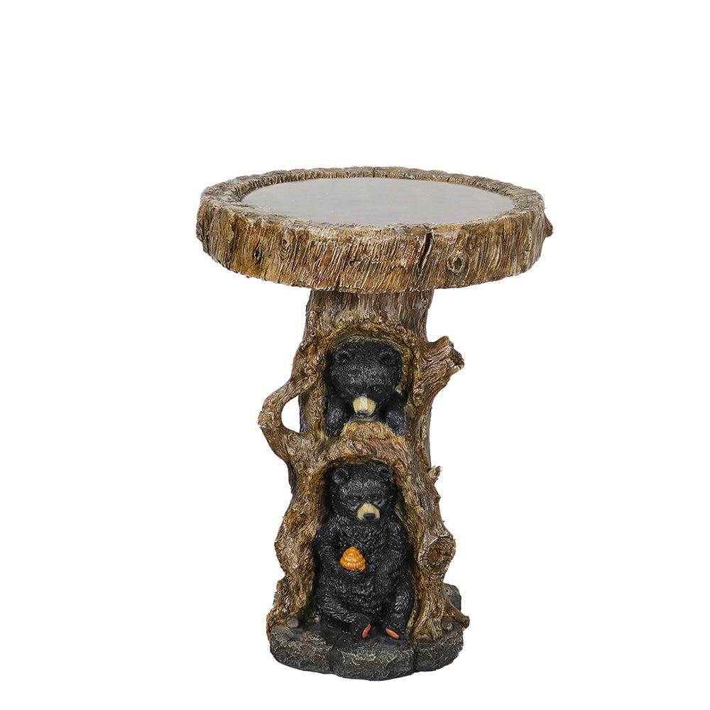 Front view of the 2-piece concrete bird bath featuring two black bears on a tree stump, isolated on a white background.