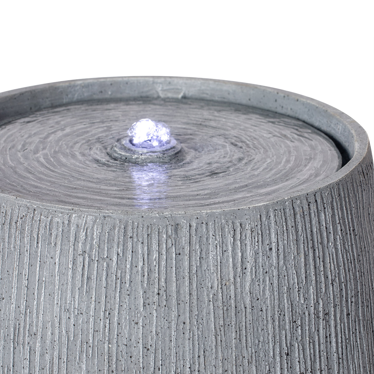 Resin Bubbler Fountain Outdoor Rippled Drum LED lit at night