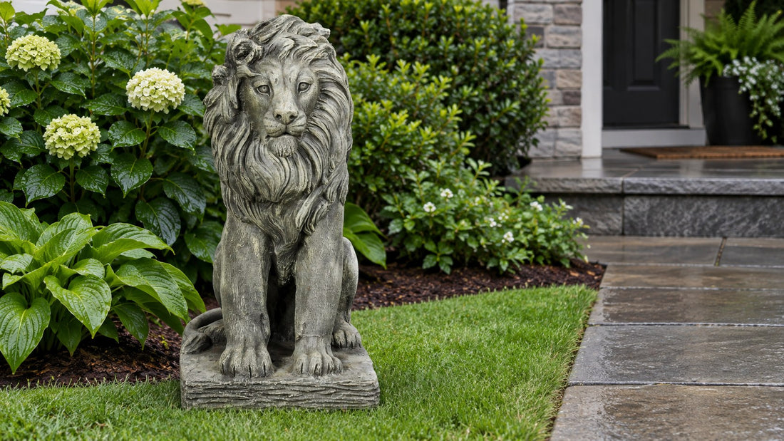 Seated cast concrete lion statue on a lawn beside a wet stone path and clipped shrubs