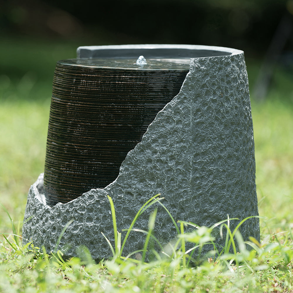 Low resin Cut Away Urn fountain with a central bubbler and exposed ribbed inner surface