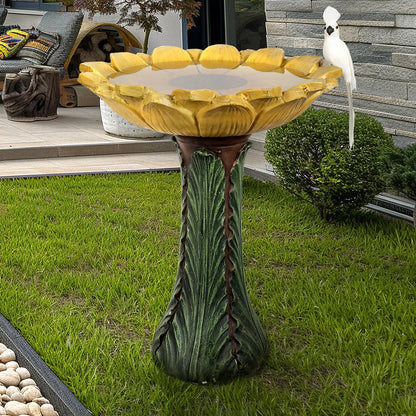 Bright yellow sunflower birdbath on a fresh green lawn centerpiece
