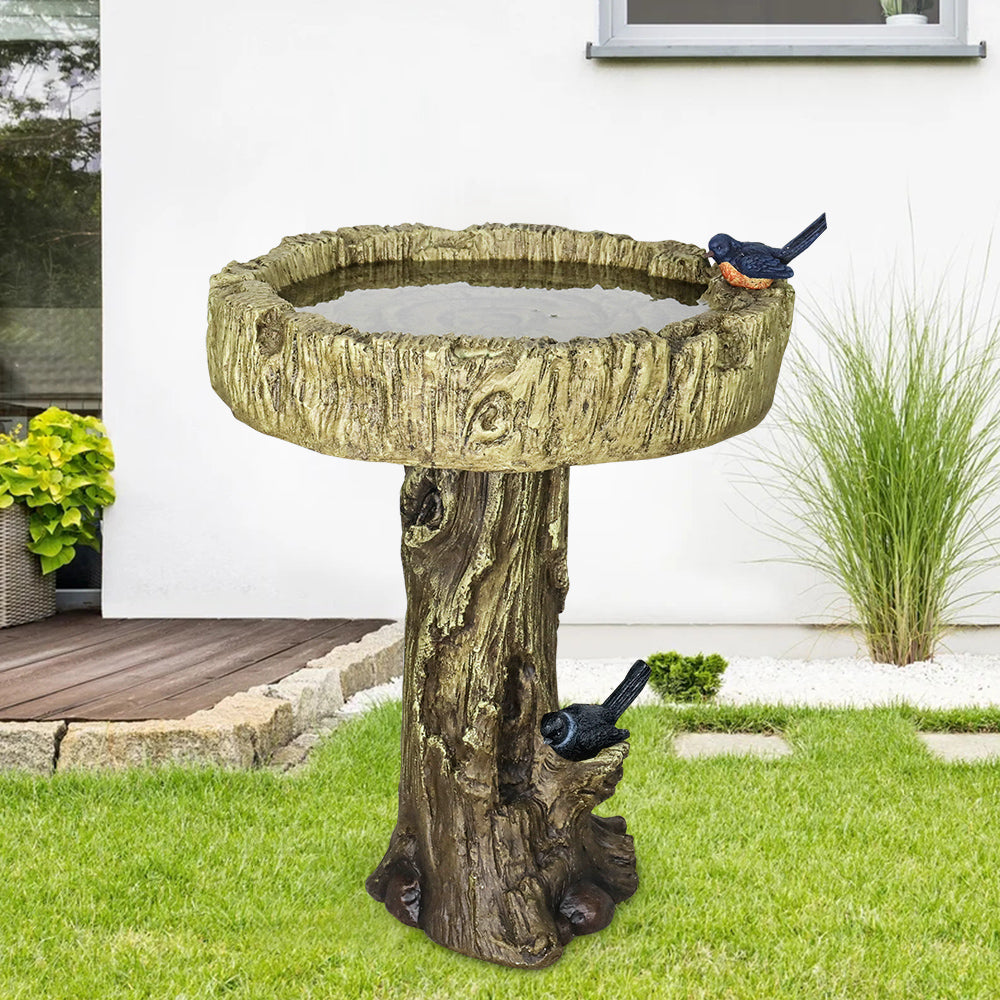 Close-up of Fiber Concrete Trunk Base Among Garden Foliage