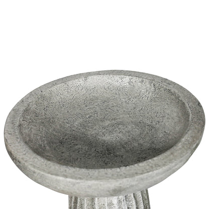 Close-up of fluted concrete bird bath base showing stable wide footing
