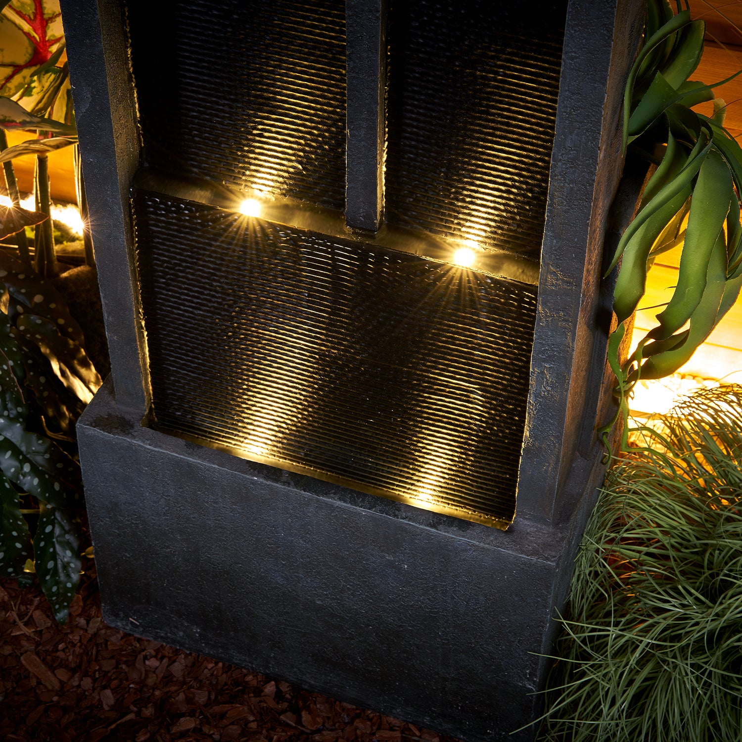 Resin Ribbed Slate Outdoor Water Fountain Quiet 50 in in garden setting