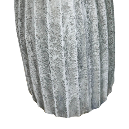 Close-up of vertical fluted concrete column pedestal showing texture detail