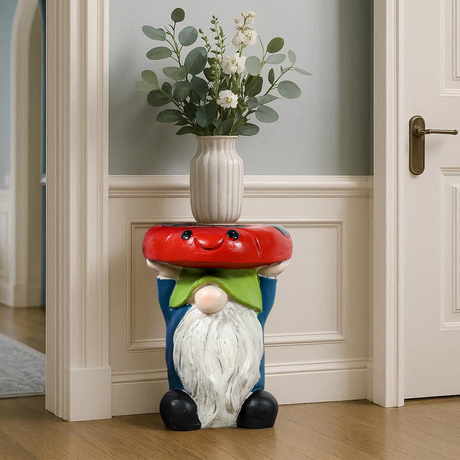 Cute gnome mushroom side table holding an elegant vase of flowers in an indoor entryway setting.