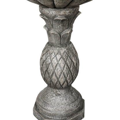 Detailed view of the intricate vintage pineapple texture on the weather-resistant concrete pedestal.
