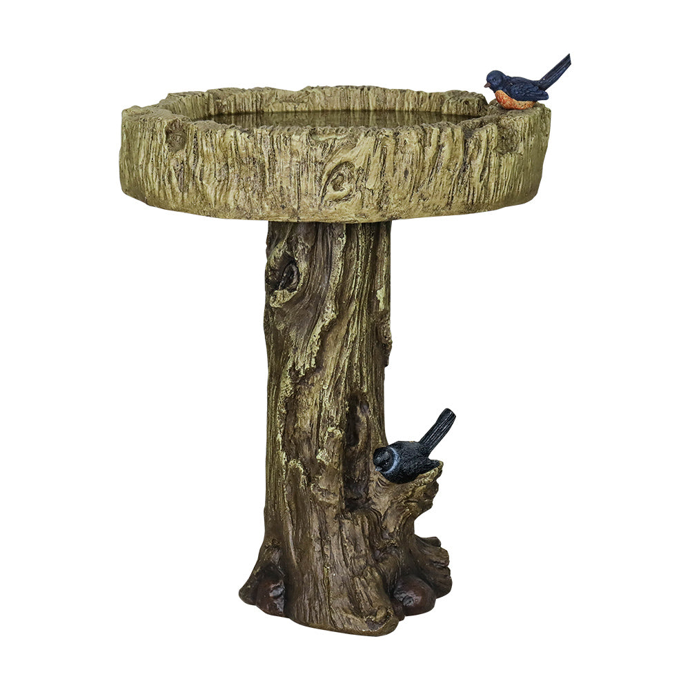 Full view of the lifelike tree trunk concrete birdbath on white.