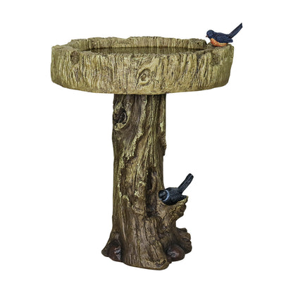 Full view of the lifelike tree trunk concrete birdbath on white.