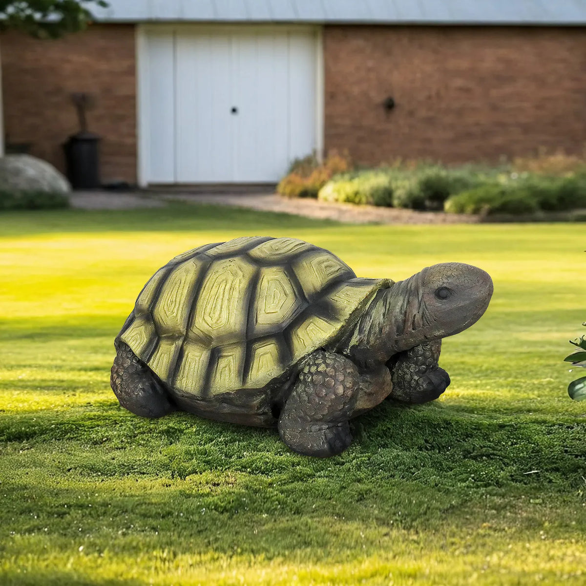 Hand-painted turtle figurine for garden decor sitting on a manicured green lawn.