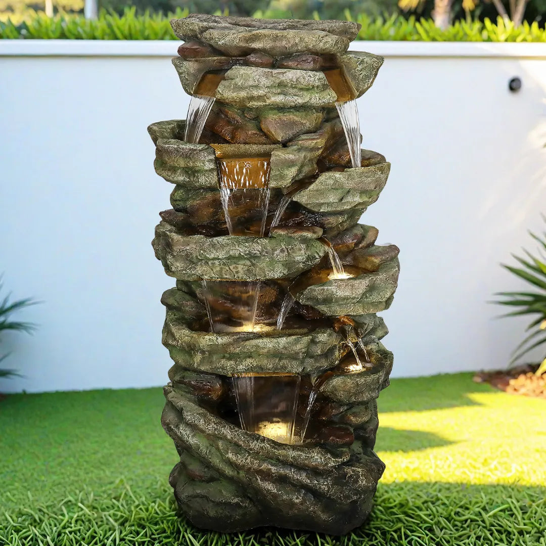 Resin Stacked Stone Rock Waterfall Outdoor Fountain LED lit at night