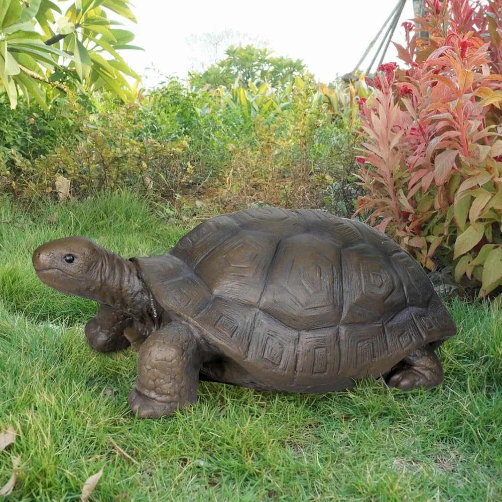 Lifelike fiber reinforced concrete turtle sculpture on a green lawn