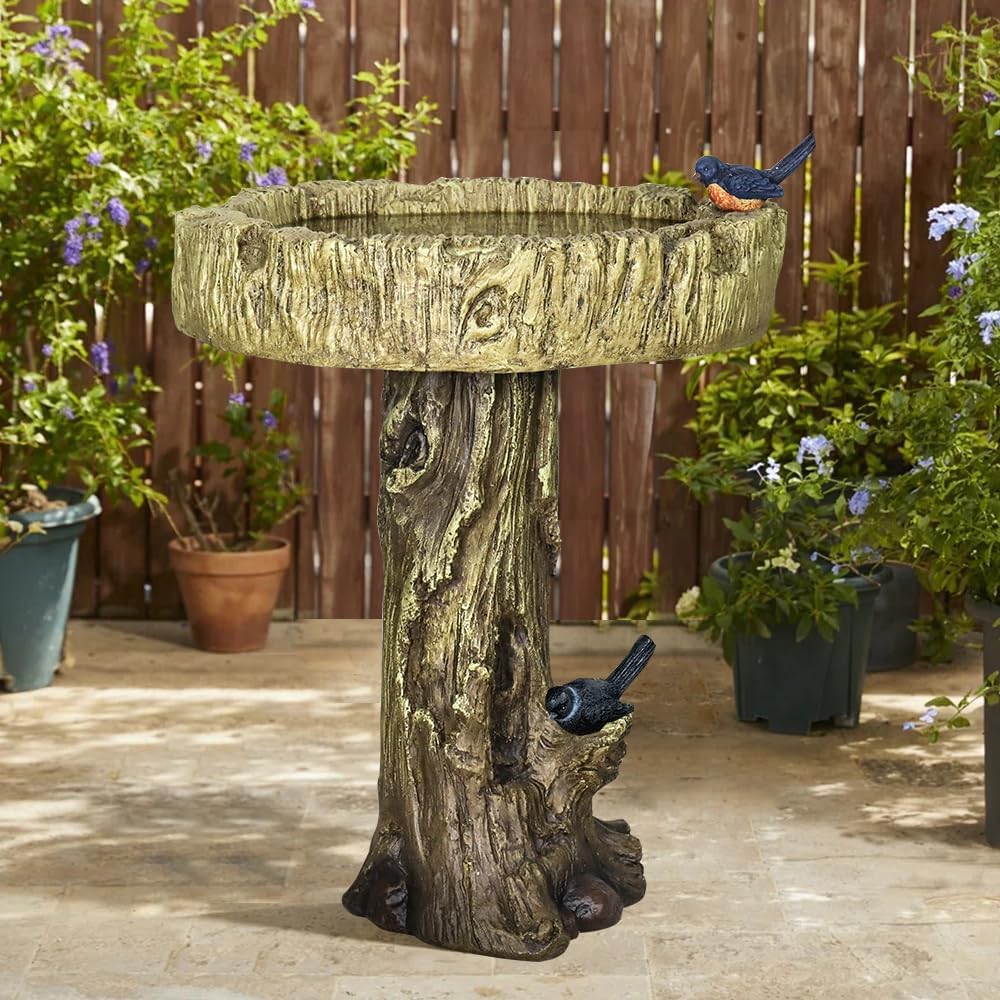 Simulated dendritic concrete birdbath in a peaceful backyard setting