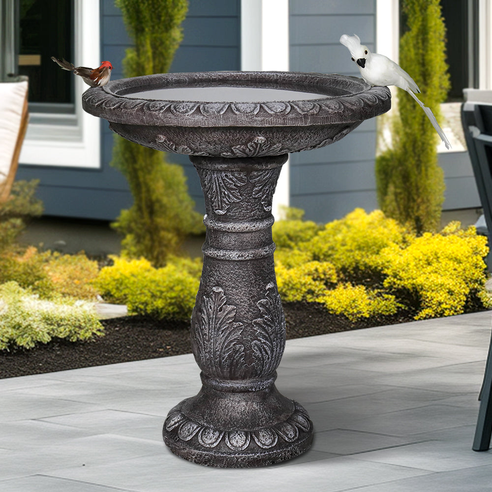 Stone-like fiber reinforced concrete birdbath in a peaceful backyard