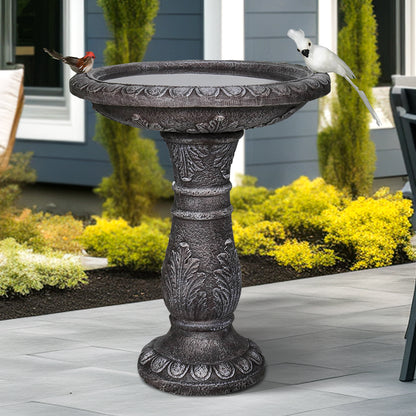 Stone-like fiber reinforced concrete birdbath in a peaceful backyard