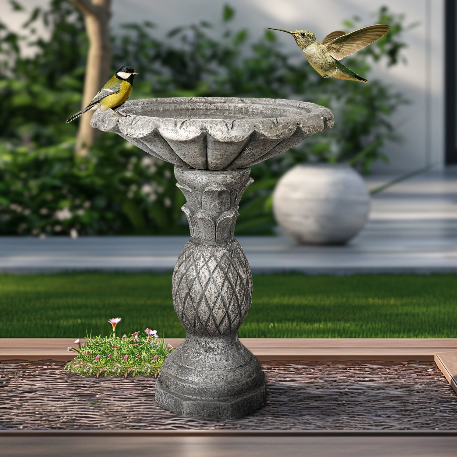 Sturdy 16.5kg heavy-duty concrete bird bath adding classic charm and stability to a garden pathway.