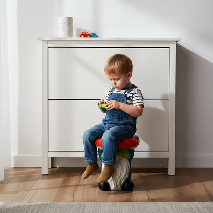 Toddler sitting securely on the cute gnome indoor stool acting as fun seating in a bright hallway.