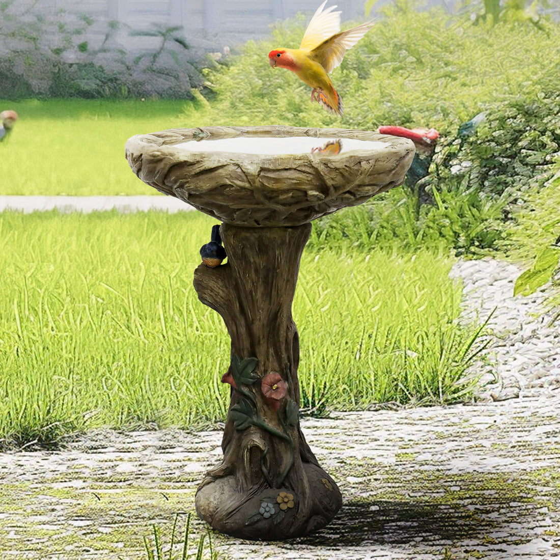 Vibrant wild bird flying towards the welcoming 17.7" diameter bowl of the concrete garden bird bath.