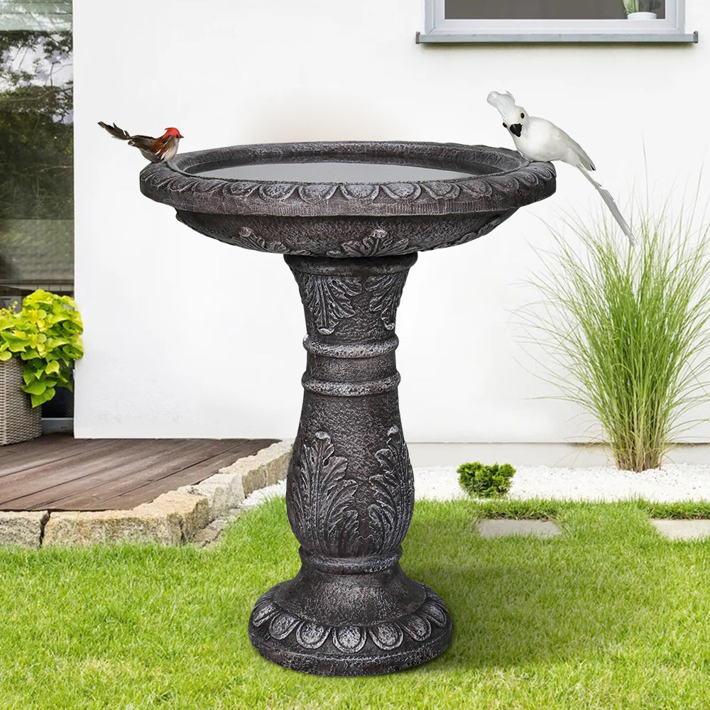 Vintage pedestal bird pond as a decorative patio focal point