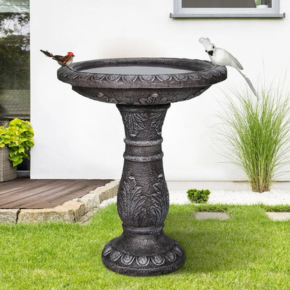 Vintage pedestal bird pond as a decorative patio focal point
