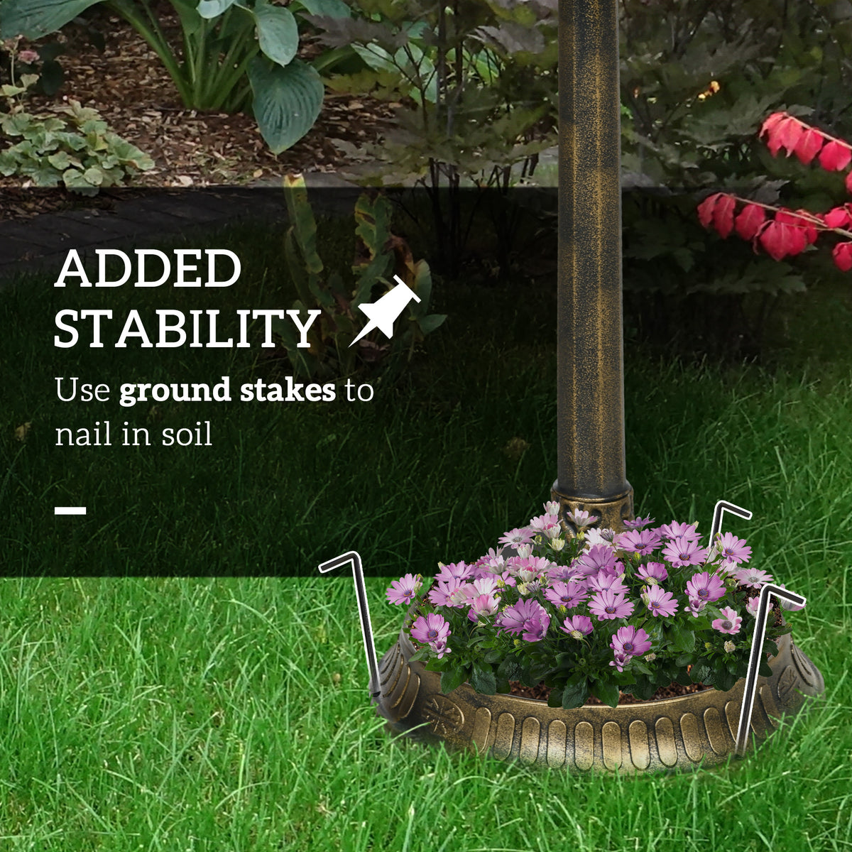 bird bath anchored with included ground stakes on lawn for stability