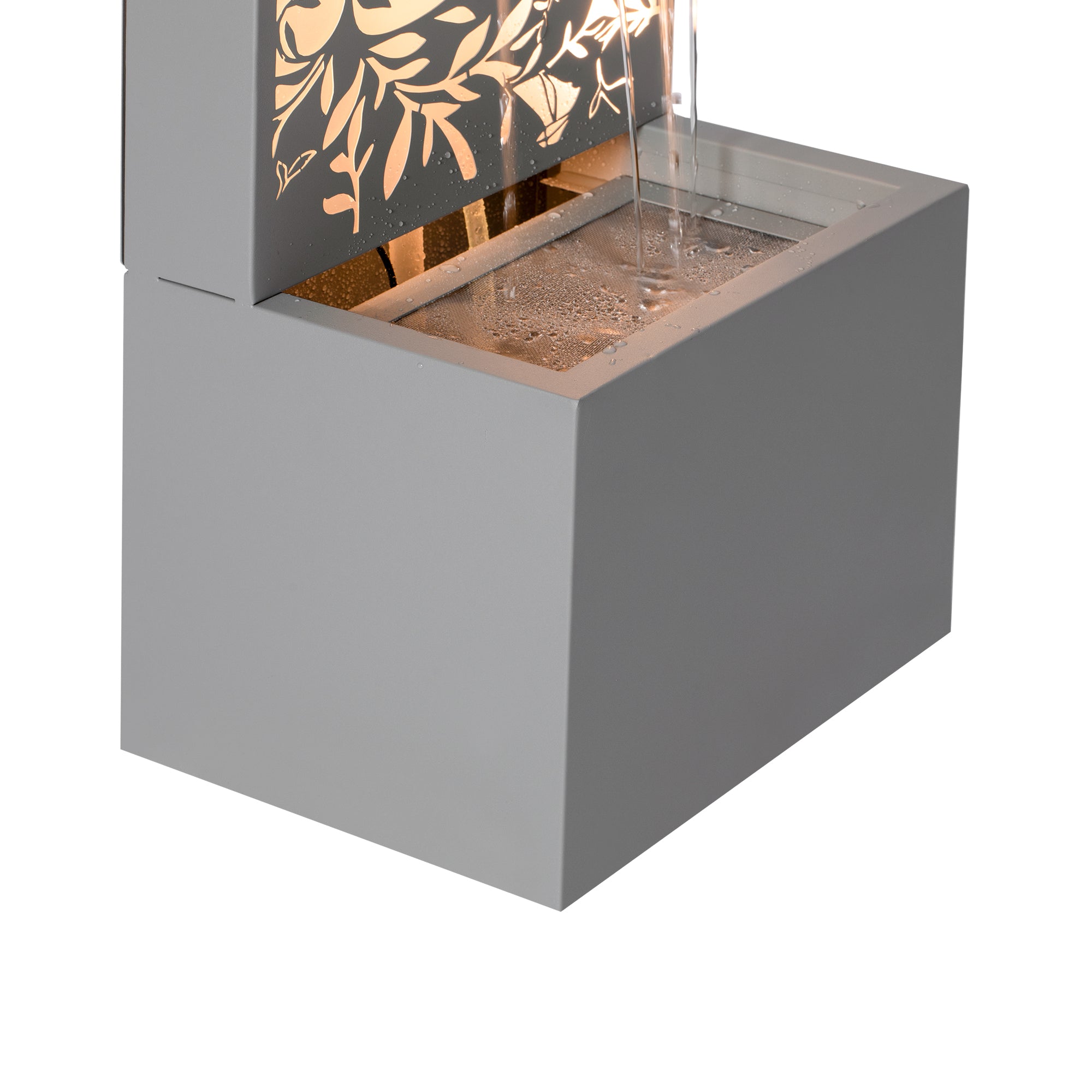 Metal Wall Fountain Outdoor Cut Leaf Panel Backlit close up of water flow