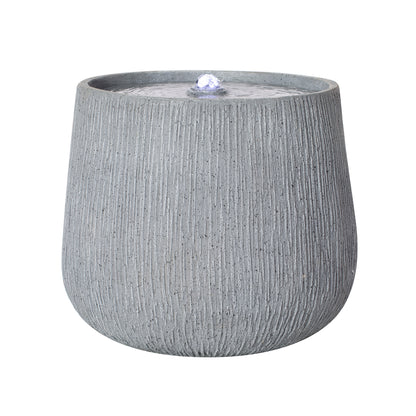 Resin Bubbler Fountain Outdoor Rippled Drum on patio