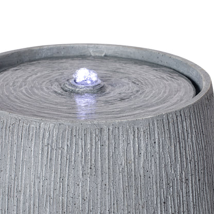 Resin Bubbler Fountain Outdoor Rippled Drum LED lit at night