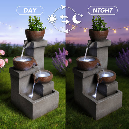 Resin Outdoor Fountain and Planter Stacked Stone LED lit at night