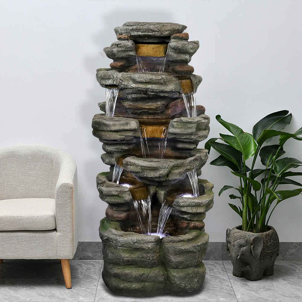 Resin Stepped Shale Outdoor Rock Fountain with Warm in garden setting