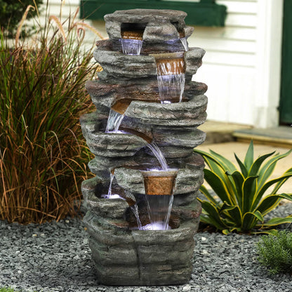Resin Serpentine Slate Column Cascading Outdoor Fountain in garden setting
