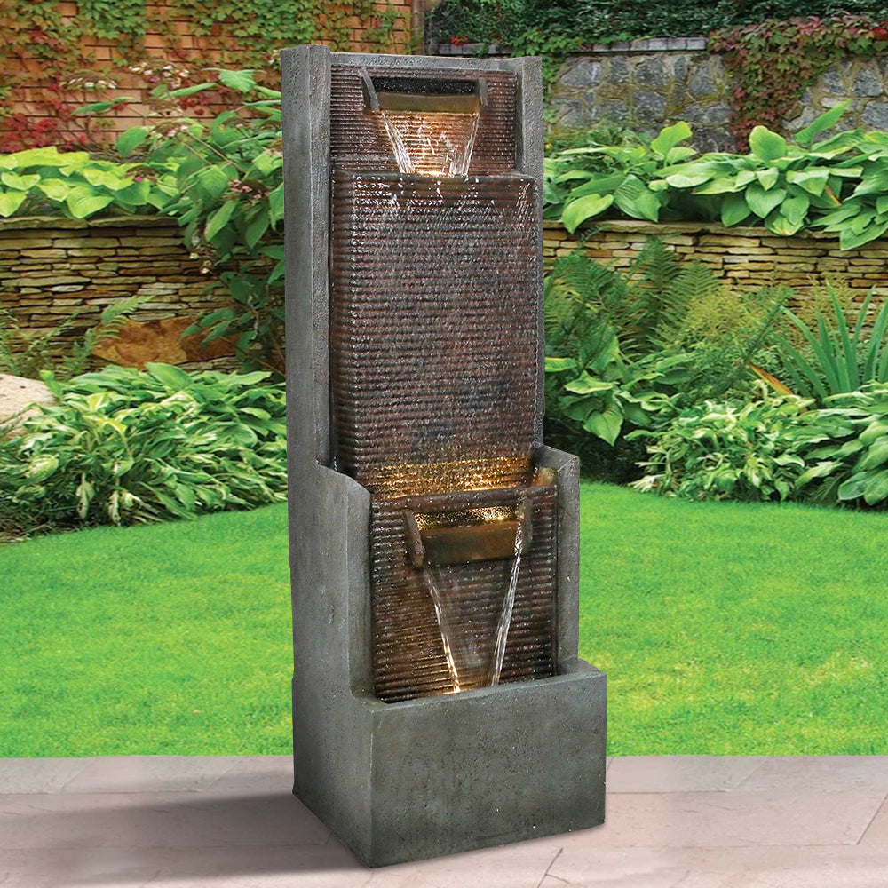 Resin Slim Outdoor Wall Fountain 39 Inch 11 Inch Deep in garden setting