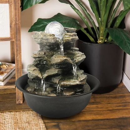 Resin Spinning Orb Tabletop Fountain 8 Inch Color in garden setting