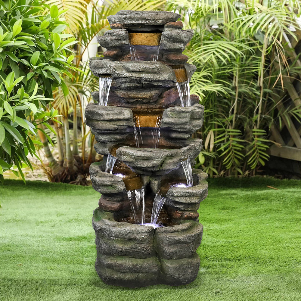 Resin Stepped Shale Outdoor Rock Fountain with Warm LED lit at night
